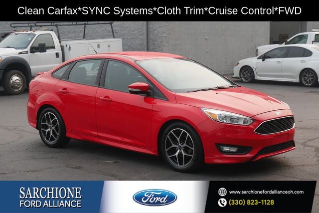 2016 Ford Focus SE in Race Red — front three-quarter view